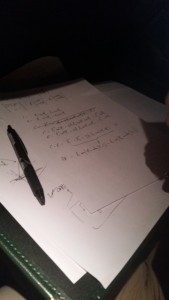Liam attempting to work out the inverse kinematic equations for the rover's arm on the plane ride to Frankfurt.