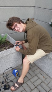 Liam soldering on a plant pot outside our hotel in Kielce - sometimes you have to improvise!